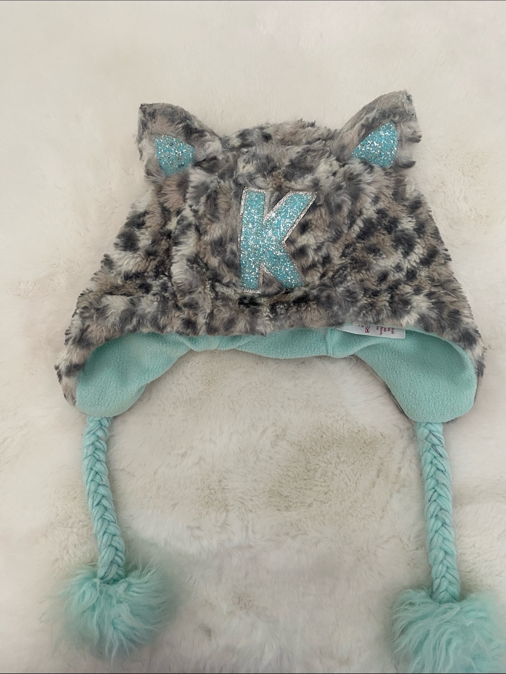 Justice Faux Fur Animal Ear Hat with Aqua Lining and Glitter 'K'